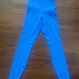 Lululemon leggings. Bright blue color with zip front waist band. Size 2.